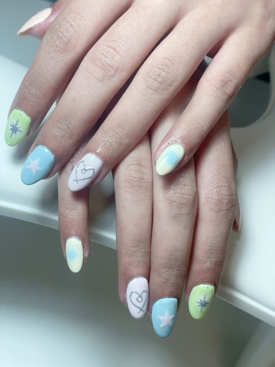 Pastel nail art with stars and hearts by Kim's Studio Lahore