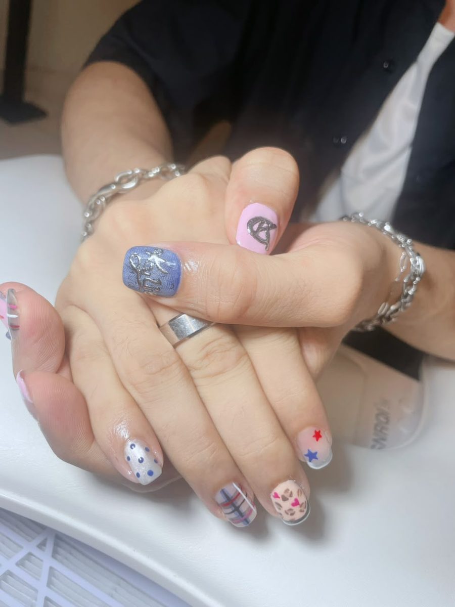 Matching couple nail sets with hand-painted initials by Kim's Studio Lahore