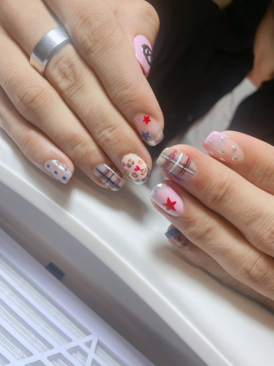 Couple nail art with painted initial detail by Kim's Studio Lahore