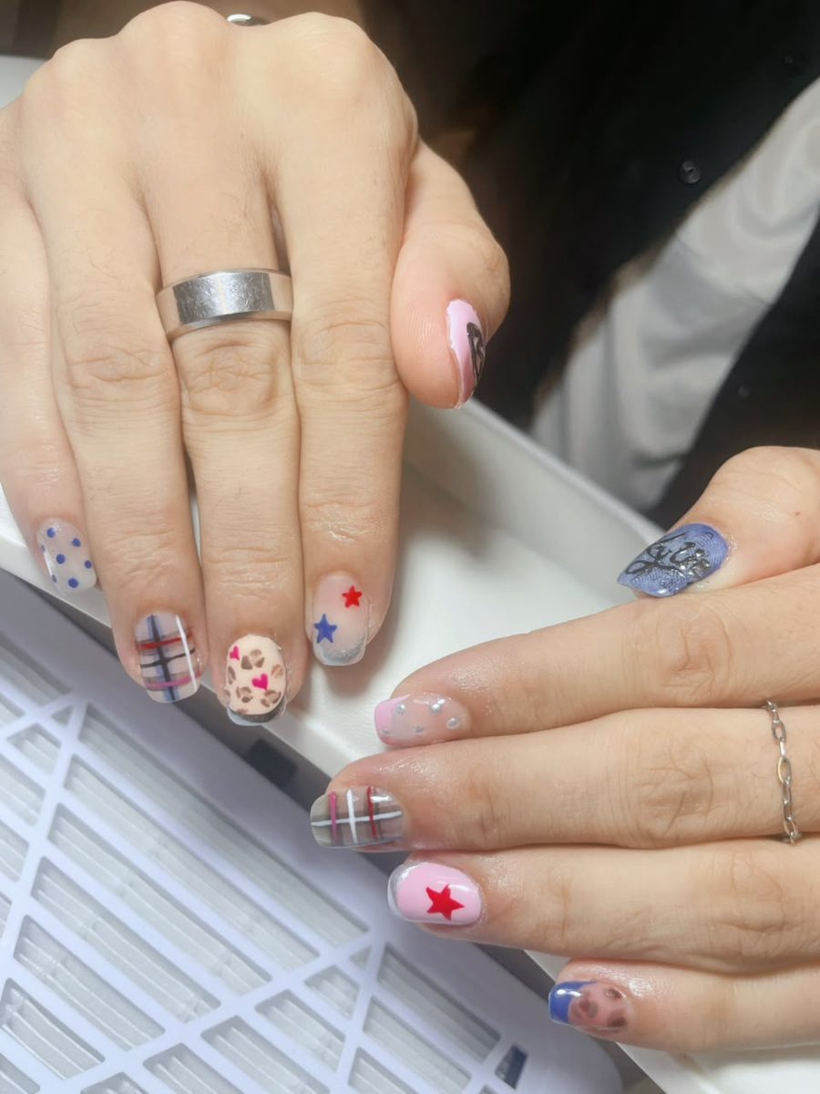Mix and match hand-painted nails with stars, plaid and leopard by Kim's Studio Lahore