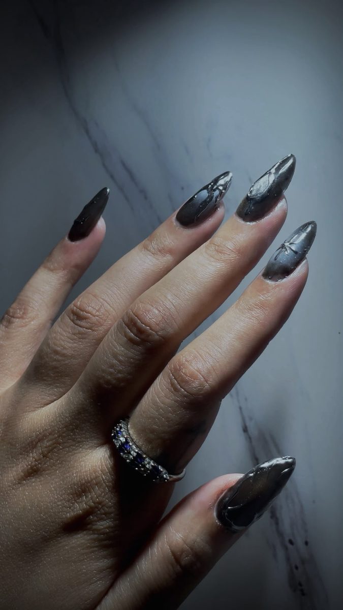 Dark chrome almond nails with liquid metal art by Kim's Studio Lahore
